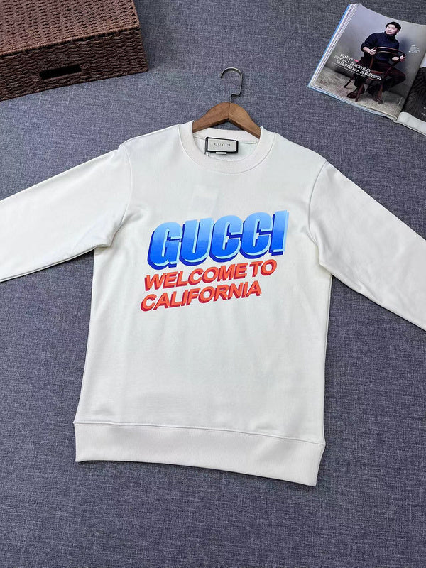 Flat lay presentation of Gucci luxury clothing with signature branding