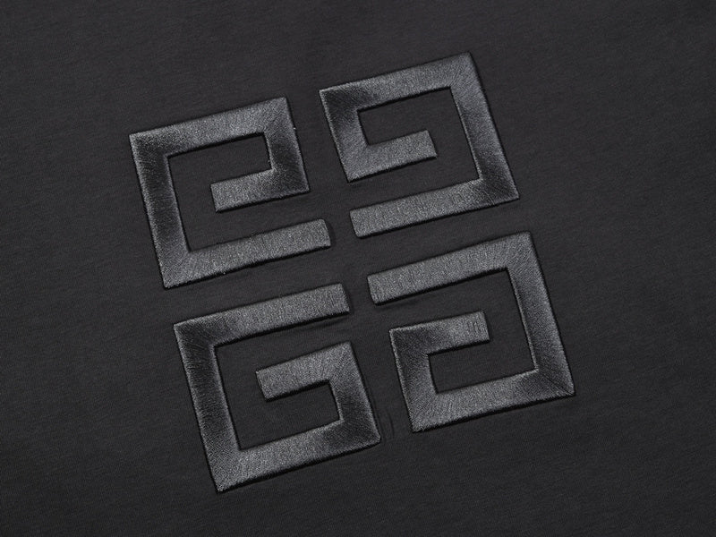 Flat lay presentation of Givenchy luxury clothing with signature branding