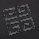 Flat lay presentation of Givenchy luxury clothing with signature branding