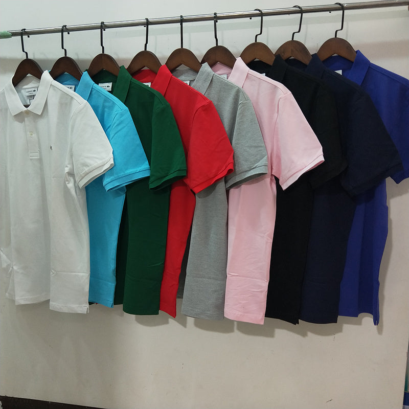 Flat lay presentation of Lacoste luxury clothing with monogram-inspired silhouette
