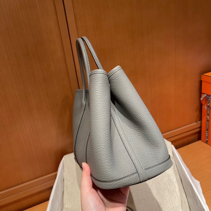 Side view of sophisticated structured handbag