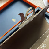 Side view of streamlined structured handbag