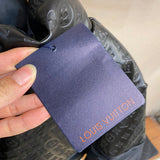 Side profile of Louis Vuitton luxury clothing with label-forward styling