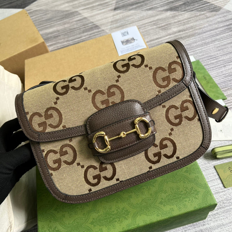 Handle and strap detail of polished classic women's handbag – women's statement bag