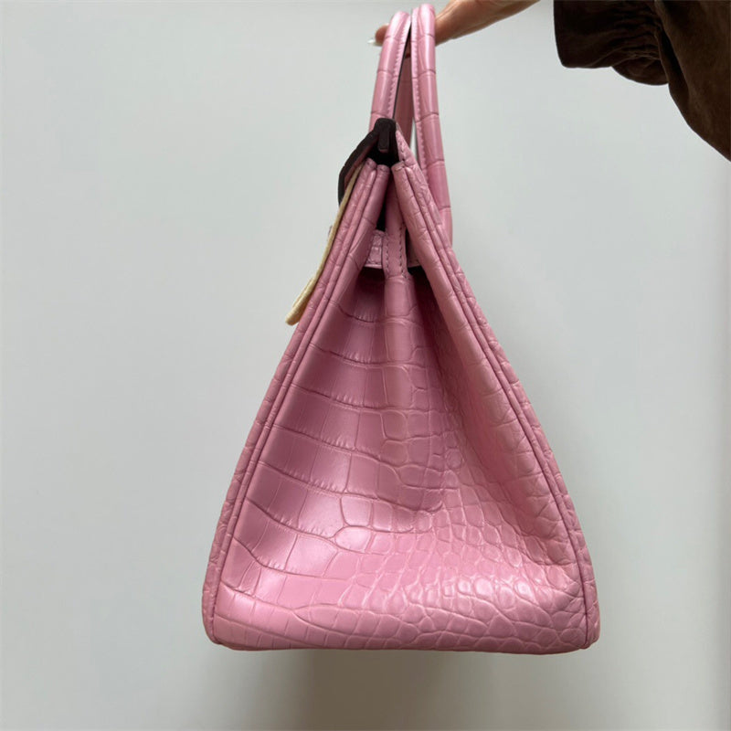 Side view of refined structured handbag