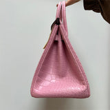 Side view of refined structured handbag