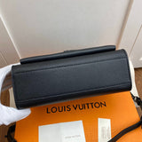 Styled lifestyle shot of elevated sleek women's handbag – women's designer-style accessory