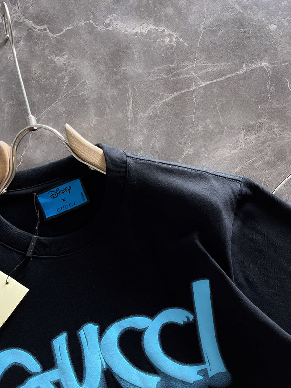 Close-up detail shot of Gucci luxury clothing with monogram-inspired silhouette