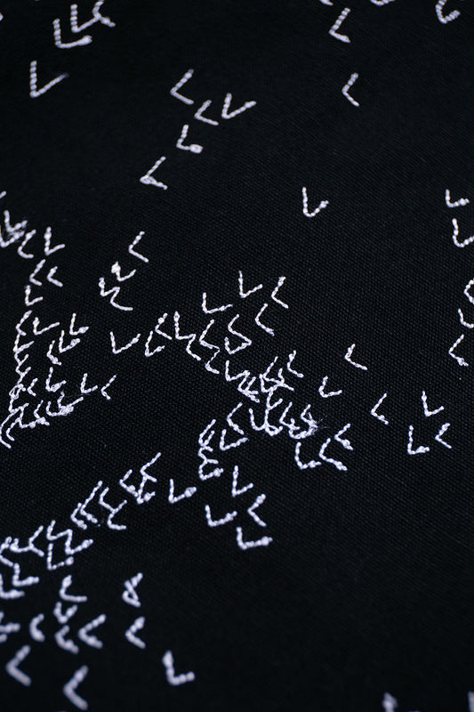 Close-up detail shot of Louis Vuitton luxury clothing with streetwear-inspired cut