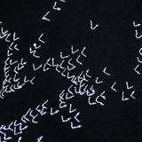 Close-up detail shot of Louis Vuitton luxury clothing with streetwear-inspired cut