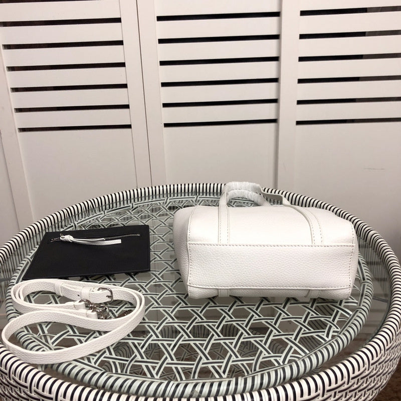 Styled lifestyle shot of statement everyday-luxe women's handbag – women's luxury accessory