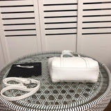 Styled lifestyle shot of statement everyday-luxe women's handbag – women's luxury accessory