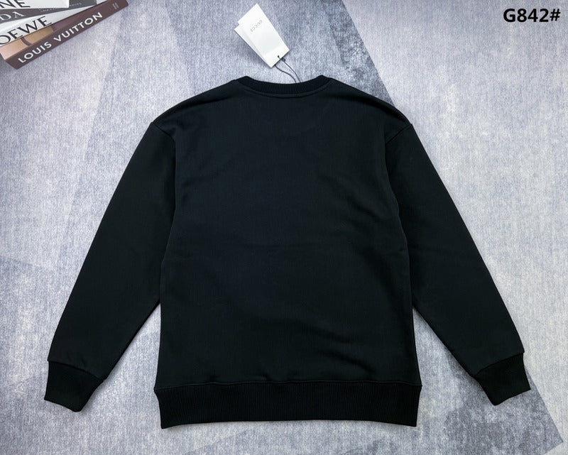 Side profile of Gucci luxury clothing with signature branding
