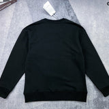 Side profile of Gucci luxury clothing with signature branding