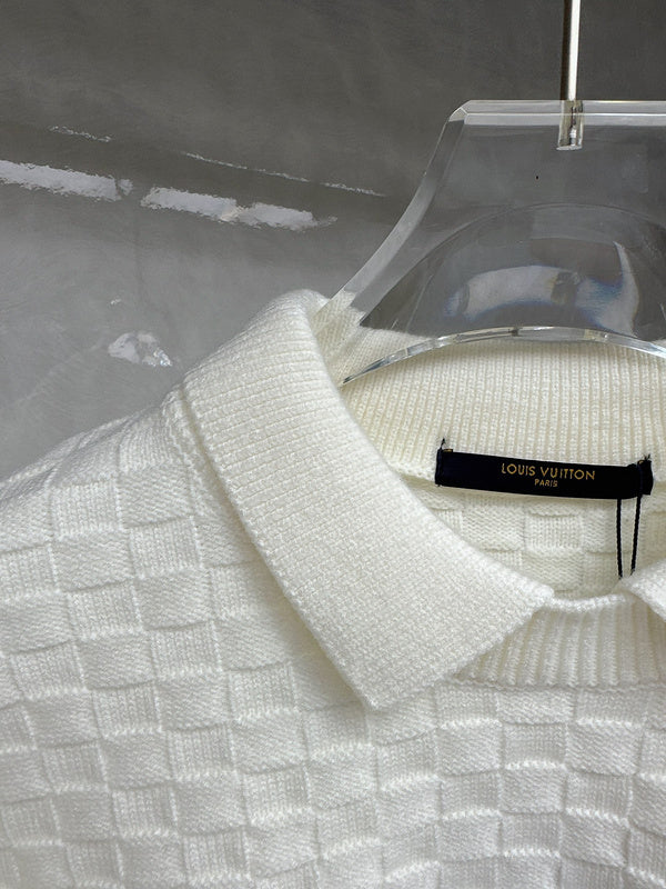 Close-up detail shot of Louis Vuitton luxury clothing with runway-inspired design