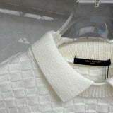 Close-up detail shot of Louis Vuitton luxury clothing with runway-inspired design