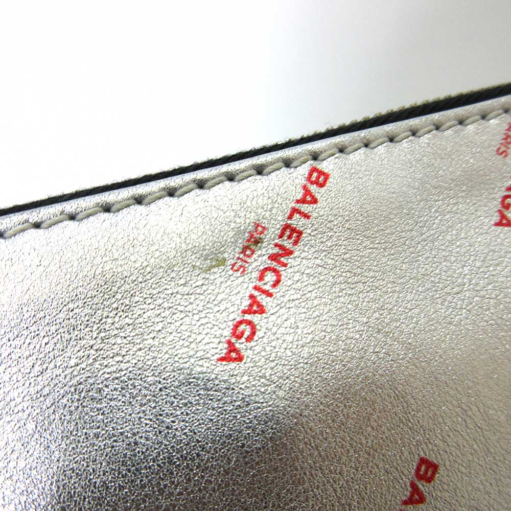 Balenciaga designer clutch leather closeup detail