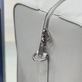Handle and strap detail of everyday-luxe signature women's handbag – women's designer-style accessory