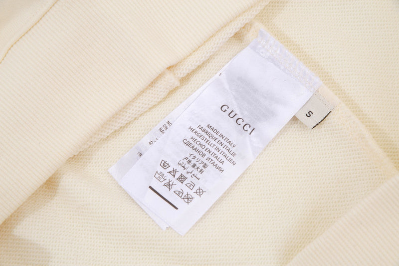 Close-up detail shot of Gucci luxury clothing with contemporary cut