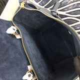 Front view of polished signature women's handbag – women's luxury accessory