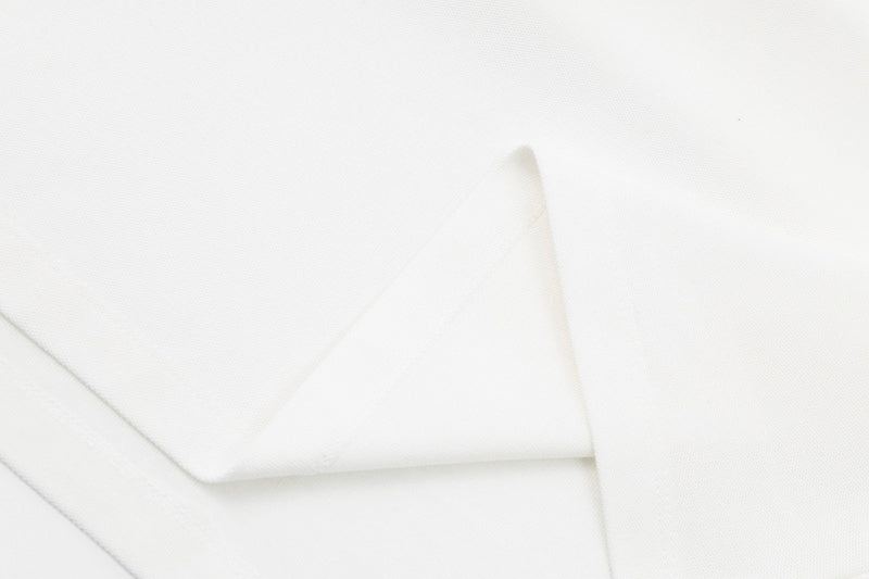 Flat lay presentation of Polo cotton polo shirt with monogram-inspired silhouette