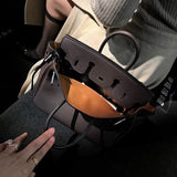 Side view of balanced structured handbag