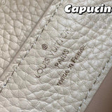 Side profile of signature chic women's handbag – women's luxury accessory