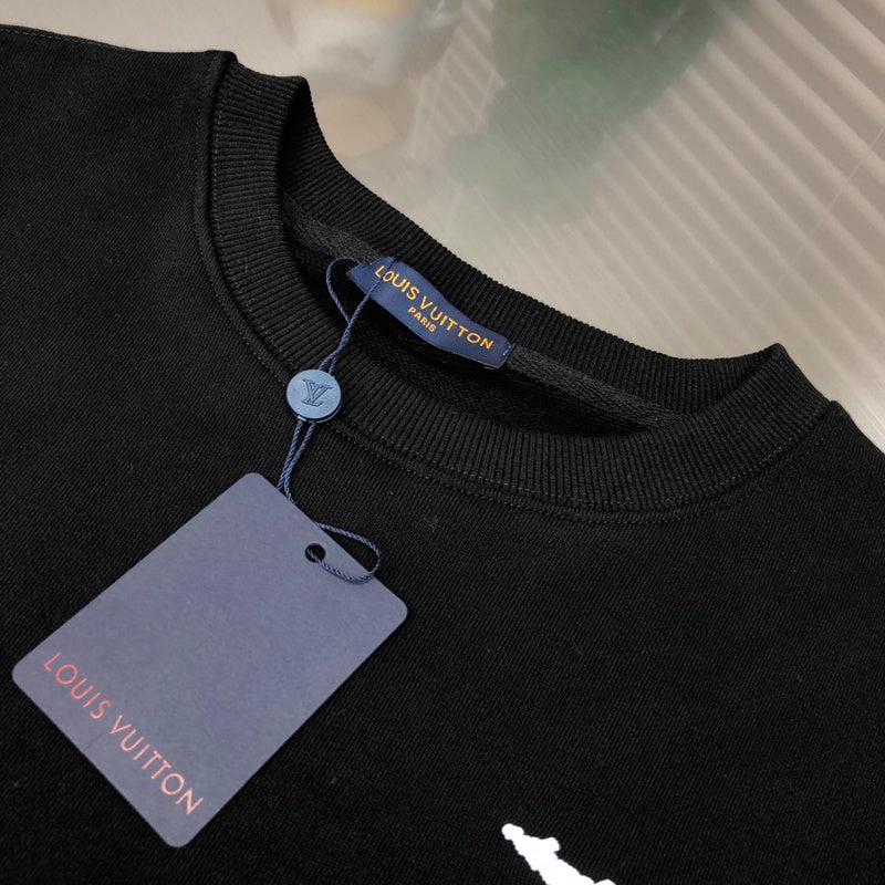 Close-up detail shot of Louis Vuitton luxury clothing with monogram-inspired silhouette