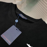 Close-up detail shot of Louis Vuitton luxury clothing with monogram-inspired silhouette