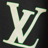 Flat lay presentation of Louis Vuitton luxury clothing with logo-detail design