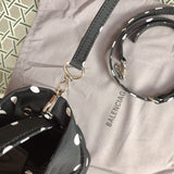 Front view of polished elevated women's handbag – women's luxury accessory