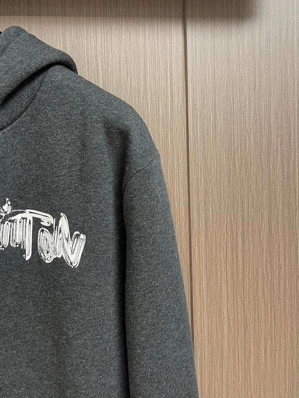Full styled look of Louis Vuitton luxury clothing with signature branding