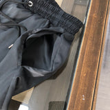 Side profile of Givenchy luxury clothing with signature branding