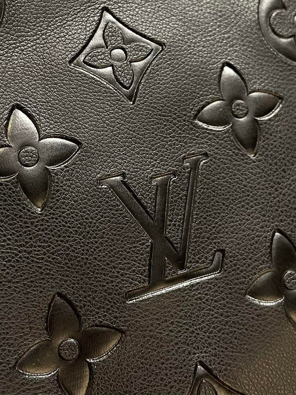 Side profile of Louis Vuitton luxury clothing with logo-detail design
