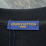 Side profile of Louis Vuitton luxury clothing with signature branding
