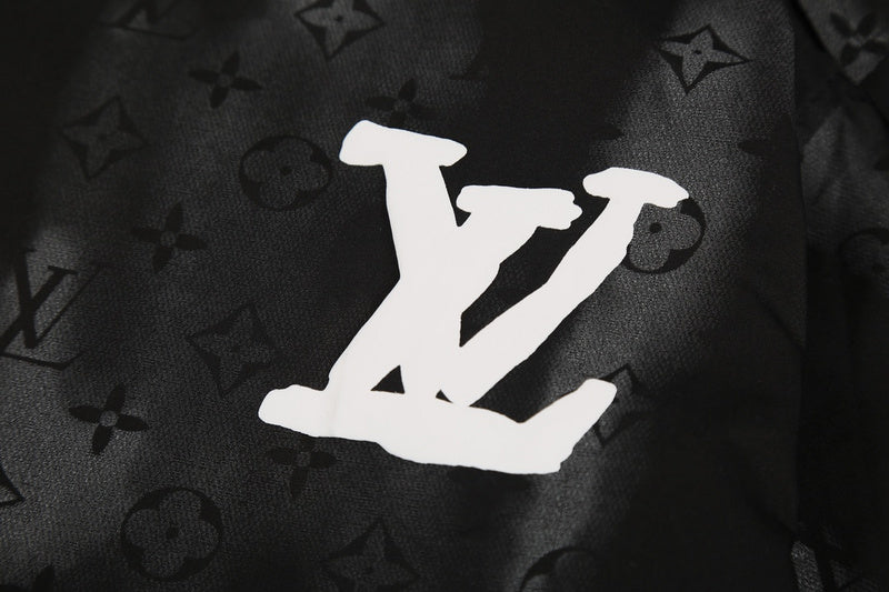 Close-up detail shot of Louis Vuitton luxury clothing with logo-detail design