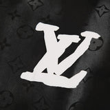 Close-up detail shot of Louis Vuitton luxury clothing with logo-detail design