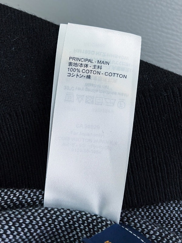 Close-up detail shot of Louis Vuitton luxury clothing with monogram-inspired silhouette