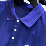 Close-up detail shot of Moncler luxury clothing with signature branding