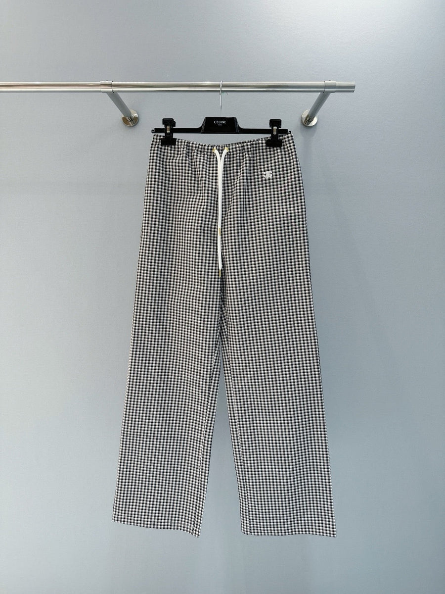 Front view of Celine premium Trousers with iconic logo hardware