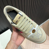 Side profile of Gucci two-tone sneakers signature lace-up style
