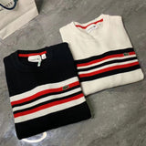 Flat lay presentation of Lacoste luxury clothing with monogram-inspired silhouette