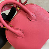 Side view of minimalist structured handbag