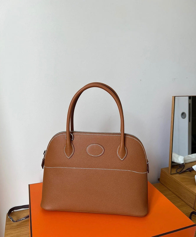 Side view of tailored structured handbag