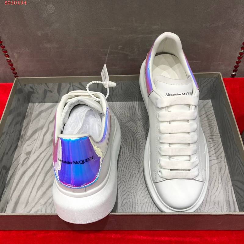 Side profile of Alexander McQueen tonal black sneakers bold athletic profile