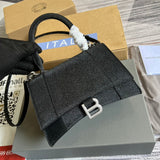 Handle and strap detail of classic signature women's handbag – women's designer-style accessory