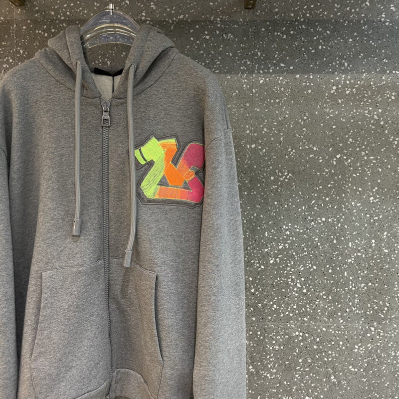 Front view of Louis Vuitton luxury clothing with label-forward styling