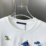 Close-up detail shot of Louis Vuitton luxury clothing with label-forward styling