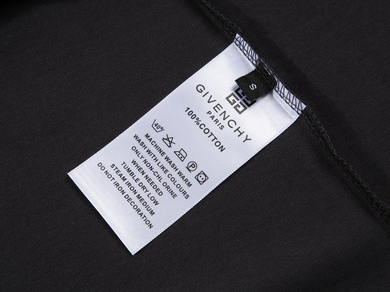 Close-up detail shot of Givenchy luxury clothing with signature branding