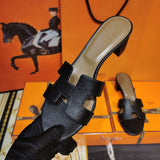 Hermes sandals Style 009 - close-up of statement logo accent